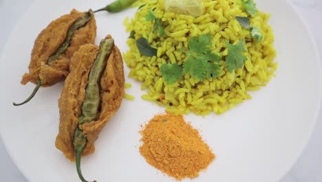 Closeup-of-South-Indian-breakfast-Puffed-rice-upma-its-has-many-names-called-uggani,-vaggani,-borugulu,-buggani,-borugula-upma-or-Mirchi-Bajji-depends-on-the-Staates-of-the-India
