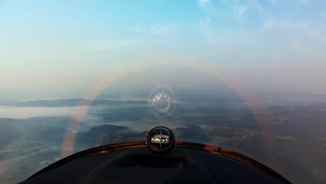 Lockdown-shot-of-compass-in-airplane-flying-over-countryside
