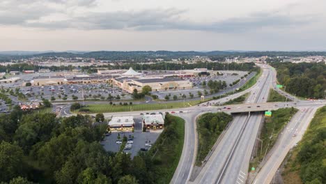 Aerial-rotating-turn-hyperlapse,-timelapse-revealing-large-retail-shopping-mall-and-highway-traffic-in-Lancaster,-Pennsylvania,-USA