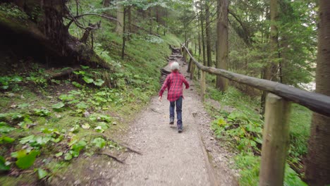 Brave-boy-hiking-along-mountain-trail
