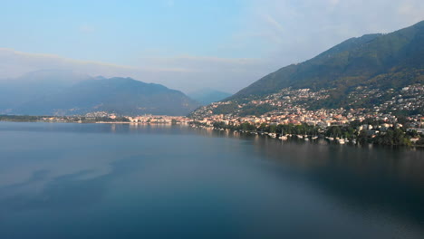 Aerial-approach-of-the-Lakeside-of-Locarno-and-Ascona,-Lake-Maggiore,-Switzerland