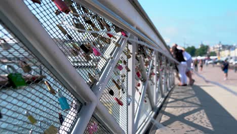 padlocks-on-a-bridge-near-the-port-in-Helsinki-Finland-and-generally-used-by-couples-to-represent-the-love-they-have-for-one-another-or-a-place-they-travel-to