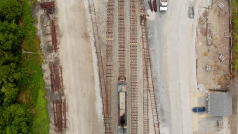 4k-footage-showing-a-train-engine-gowing-out-of-view-at-the-bottom-with-multiple-tracks-alongside
