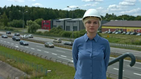 A-professional-woman-engineer-wearing-a-helmet-to-selt-an-example-to-worker-of-safety-in-the-work-place