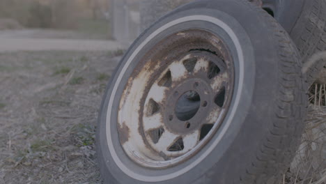 rusty-rim-and-tire-at-a-dump