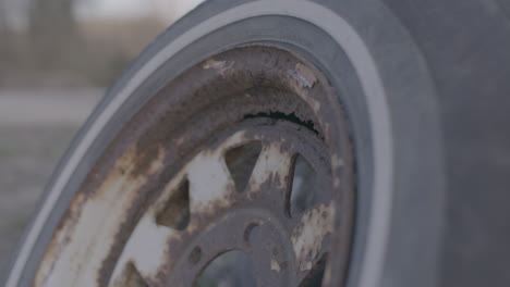 rusted-rim-and-tire-at-a-dump