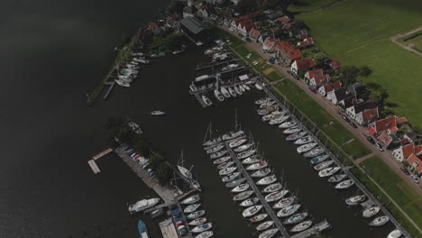 Aerial-view-of-marine-port-area-for-pleasure-boats-and-sailboats-with-typical-houses-of-the-Dutch-village-of-Durgerdam-at-the-Durgerdammerdijk-near-Amsterdam