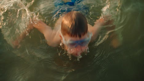Kid-diving-in-water-slow-motion-video