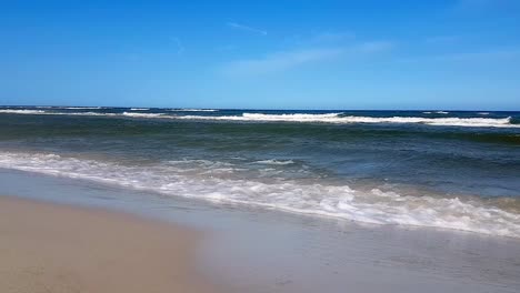 Waves-On-Sandy-Beach-On-A-Sunny-Day-Slowmotion-Shot
