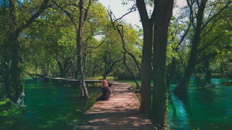Beautiful-4K-UHD-Cinemagraph-of-waterfalls-in-Krka-National-Park-in-Croatia-in-early-summer-with-a-young-woman