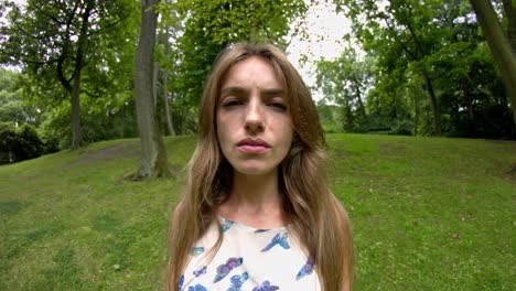 Allergic-woman-in-the-park-suffers-from-pain-due-to-allergens
