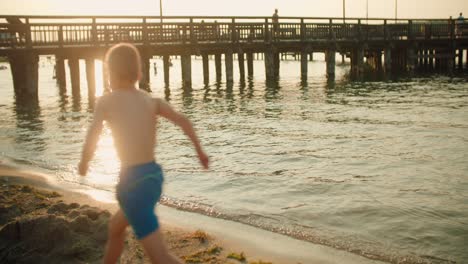 Kid-running-on-the-beach-slow-motion