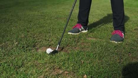 Girl-at-golf-training-taking-the-shot