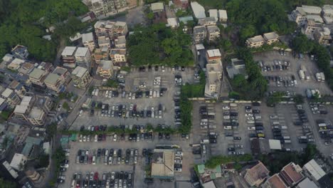 typical-south-Chinese-village-with-a-big-parking-in-the-middle-in-an-urban-area-with-some-wood-around