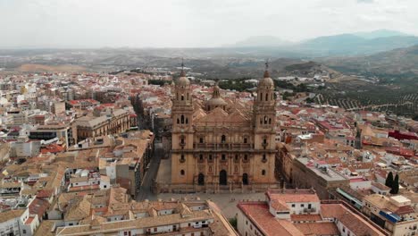 Spain-Jaen-Cathedral,-Catedral-de-Jaen,-flying-shoots-of-this-old-church-with-a-drone-at-4k-24fps-using-a-ND-filter-also-it-can-be-seen-the-old-town-of-Jaen