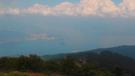 Lago-Maggiore-during-an-overcast-day-in-the-summer,-viewed-from-on-top-of-a-mountain