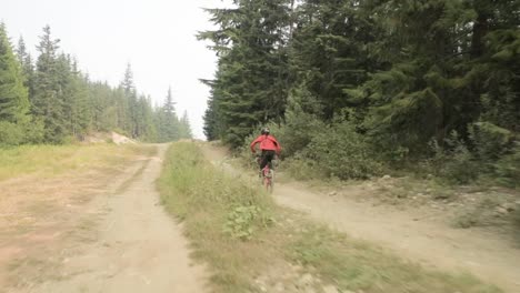 Mountain-bike-rider-riding-along-trail-in-the-bike-park