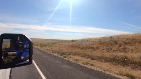 POV-out-of-the-passenger's-side-window-while-driving-thru-an-agricultural-area-of-Eastern-Washington-State