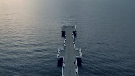 Aerial-footage-over-molo,-pier-during-sunrise