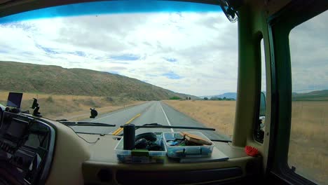 POV-of-the-passenger-while-riding-in-a-Class-A-RV-that-is-driving-through-the-Okanogan-Highlands-of-north-central-Washington-State
