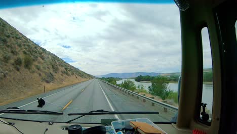 POV-of-the-passenger-while-driving-along-the-Columbia-River-an-agricultural-area-of-the-Columbia-Basin-of-north-central-Washington-State