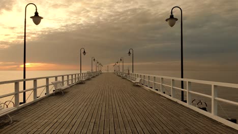 Slow-passage-over-a-wooden-pier-at-sunrise