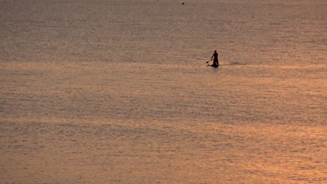 Sunset-Silhouette-of-Man-on-Paddle-Board