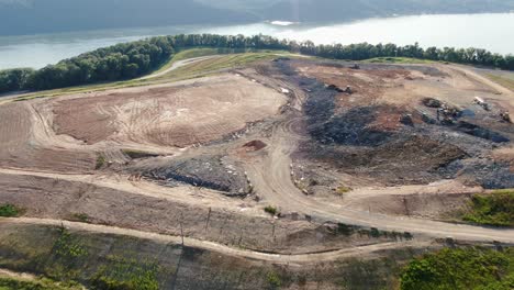 Aerial-drone-shot-of-landfill-dump-with-toxic-waste,-recycling,-terraces-and-equipment-in-Lancaster-County-Pennsylvania-by-Susquehanna-River
