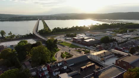 Aerial-drone-shot-of-Columbia-Pennsylvania-with-sun-setting-on-the-Susquehanna-River