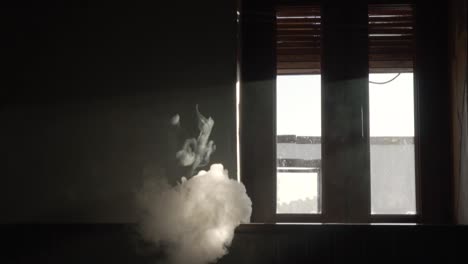 Smoke-from-a-vaper-in-a-dark-room-in-slow-motion