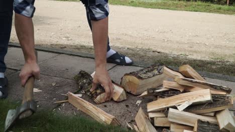 Young-man-is-chopping-wood-for-the-for-the-fire-place
