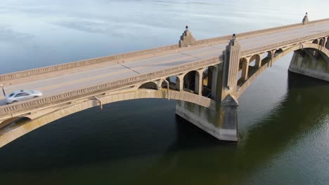 Close-up-aerial-drone-panning-shot-reveals-large-concrete-bridge-arches-and-architecture-spanning-Susquehanna-River-in-Pennsylvania