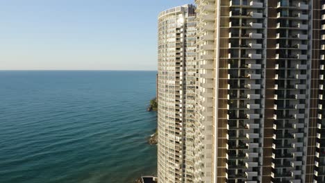 Aerial-shot-of-High-Rise-Condominiums-along-the-Water-[4k