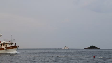 Small-tourist-ship-on-a-gloomy-day-in-Croatia-in-slow-motion
