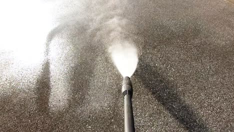 High-pressure-water-cleaner,-slow-motion,-concrete-dirt-removal
