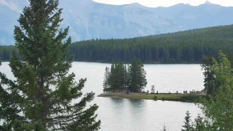 Landscape-beautiful-natural-view-of-Two-Jack-Lake-with-beautiful-pine-tree-forest-and-rockies-mountain-in-background-in-Banff-National-Park,Alberta,Canada-in-summer-sunshine-daytime