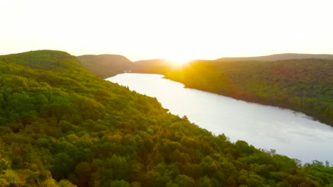 Aerial-Pullback-to-reveal-Lake-of-the-Clouds-in-Michigan's-Porcupine-Mountains-during-Sunrise