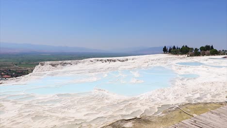 Light-blue-natural-pools-filled-with-water-at-the-great-travel-destination-Pamukkale-in-Turkey