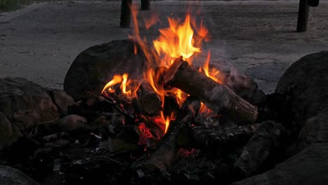 A-medium-to-close-up-shot-of-a-bonfire-started-at-a-campsite