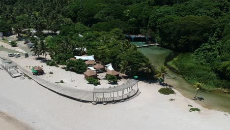 A-spring-fed-river-flows-into-the-ocean-at-Los-Patos,-Dominican-Republic