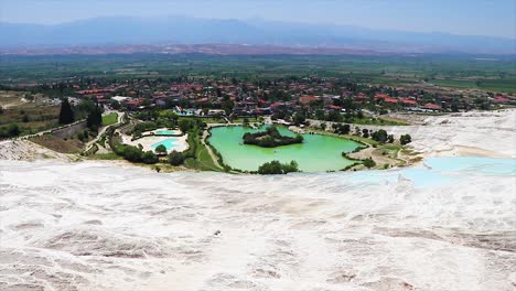 Panorama-of-the-white-marble-and-water-ponds-of-Pamukkale-with-the-valley-in-front-of-it