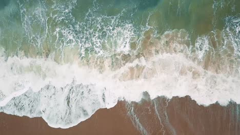 Aerial-Footage-of-waves-on-sandy-beach