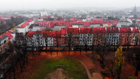 A-fly-up-drone-shot-of-an-autumnal-city-on-a-cold-day-in-Poland