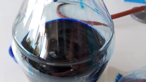 Close-Up-filtration-of-coomassie-blue-liquid-solution-in-glass-flask