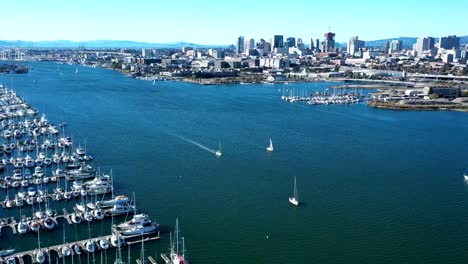 Hyper-lapse-of-a-large-Marina-with-sailboats-and-views-of-the-city
