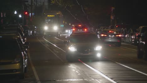 Baltimore-Avenue-Traffic,-Cars,-Headlights,-night,-West-Philadelphia