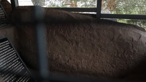 Pan-view-of-Protected-Inscriptions-or-rock-edicts-of-Emperor-Ashoka-on-rock-boulder-at-Maski,-Raichur,-India