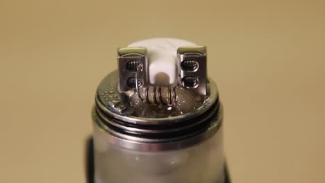 Smoke-coming-out-of-the-wet-wadding-on-vape-coil