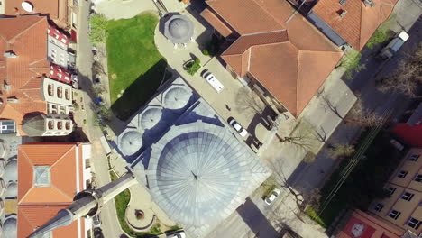 Aerial-view-of-Sahat-Kulla-Prishtine-and-Imperial-Mosque,-Kosovo