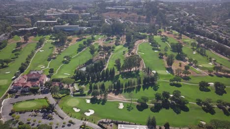 Aerial-time-lapse-of-golf-ground-flying-the-drone-forward-with-trees-grass-highway